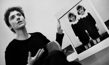 Diane Arbus with her photograph Identical twins, Roselle, N.J. 1966, during a lecture at the Rhode Island School of Design in 1970.