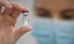 NHS Wales Starts Covid-19 Vaccination Campaign<br>CARDIFF, WALES - DECEMBER 08: A member of staff poses with a phial of Pfizer-BioNTech Covid-19 vaccine at a vaccination health centre on the first day of the largest immunisation programme in the UK's history on December 8, 2020 in Cardiff, United Kingdom. Wales joined the other UK nations in rolling out the covid-19 vaccine on Tuesday, a rare moment of coordination after months of disjointedness in the four nations' pandemic response. Wales introduced a 17-day "firebreak" lockdown in October and November to suppress the surge in covid-19 cases, but infections have continued to rise. (Photo by Justin Tallis - Pool / Getty Images)