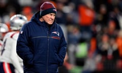 Head coach Bill Belichick of the New England Patriots walks on to the field prior to the game against the Denver Broncos at Mile High Stadium on Christmas Eve