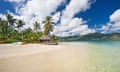 Beautiful clear water and a white sandy beach around a tropical island in Fiji