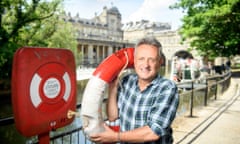 The theatre producer David Pugh in Bath where his production of Charlie and Stan will show at the Theatre Royal. Pictured at Pulteney Weir with a prop from the play.<br>Pics - Adrian Sherratt - 07976 237651 The theatre producer David Pugh in Bath where his production of Charlie and Stan will show at the Theatre Royal. Pictured at Pulteney Weir with a prop from the play (19 July 2021).