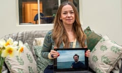 Dr Katie Sidle holding a photo of her brother