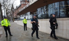 Activity In Westminster After London Terror Attack<br>LONDON, ENGLAND - MARCH 23: Armed police officers patrol outside New Scotland Yard following yesterday's attack on March 23, 2017 in London, England. Four people have been killed and around 40 people injured following yesterday's attack by the Houses of Parliament in Westminster. (Photo by Jack Taylor/Getty Images)