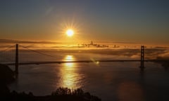 sun rising over the bridge