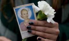 A woman holds a photo of Argentina's late first lady Maria Eva Duarte de Peron, better known as Evita