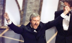 James Cameron celebrates winning the best director Oscar for Titanic in 1998