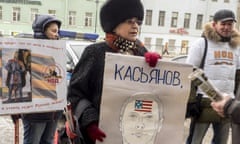 RPR-Parnas Party chairman Mikhail Kasyanov meets with supporters in St Petersburg<br>ST. PETERSBURG, RUSSIA. FEBRUARY 6, 2016. An activist of the Russian National Liberation Movement (NOD) holds a sign reading "Kasyanov, how much is conscience worth these days?" during a rally against RPR-Parnas Party chairman Mikhail Kasyanov's meeting with supporters at the Oktyabrskaya Hotel. Ruslan Shamukov/TASS (Photo by Ruslan Shamukov\TASS via Getty Images)