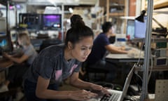 Focused female engineer working at laptop in workshop<br>GettyImages-769719663