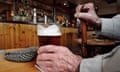 A man holding a pint of bitter in a pub in Boston, Lincolnshire