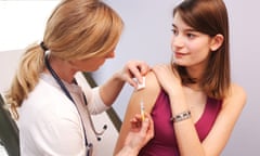 A doctor administers a vaccine.