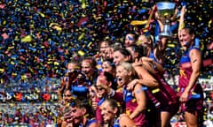 The Lions pose with the 2023 AFLW Premiership Trophy surrounded by confetti