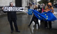 Bloomberg Best Of The Year 2016<br>DECADE END. DO NOT USE. FOR THAT’S ME IN THE PICTURE WEEKEND INTERVIEW NOV 23. Bloomberg Best of the Year 2016: A protestor holds a sign disrupting a pro-EU demonstration outside the Royal Courts of Justice, in London, U.K., on Monday, Oct. 17, 2016. The prime minister’s most senior legal adviser, Attorney General Jeremy Wright, will attempt to convince a judge that Theresa May can trigger Article 50 of the Lisbon Treaty, which starts an exit, without approval from her fellow lawmakers. Photographer: Simon Dawson/Bloomberg via Getty Images