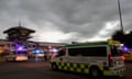 Emergency ambulance vehicles arrive to take injured passengers from a flight from London to Singapore to a hospital in Thailand