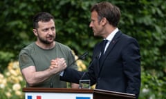 Ukrainian President Volodymyr Zelensky and Frances President Emmanuel Macron shake hands after a press conference on June 16, 2022 in Kyiv, Ukraine.  Elections for MEPs are being held on 6-9 June.