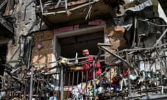 A rescue worker on Saturday at a residential building in Zaporizhzhia damaged by a Russian missile strike