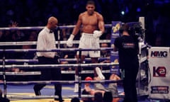 Anthony Joshua stands over Wladimir Klitschko
after putting him on the canvas in the 11th round of their bout at Wembley Stadium.