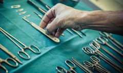 surgical instruments and tools including scalpels, forceps and tweezers arranged on a table for a surgery<br>EAKR4G surgical instruments and tools including scalpels, forceps and tweezers arranged on a table for a surgery