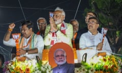 Narendra Modi participating in a roadshow during an election campaign ahead of India's election
