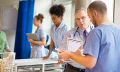 doctor talking to medical staff