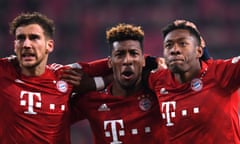 David Alaba (right) celebrates scoring Bayern Munich’s third goal with Kingsley Coman, scorer of the other two, and Leon Goretzka (left) who scored an own goal after 13 seconds against Augsburg