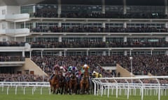 The runners make their way round the top bend during the Pertemps Final at the 2019 Cheltenham Festival.