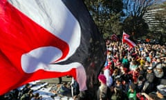 People attend a protest criticising the government for its policies toward the Indigenous Maori population which they say are racist policies and undermine a treaty that protects their Indigenous rights