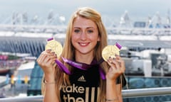 Cyclist Laura Trott poses with her gold medals in 2012.