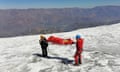 This photo distributed by the Peruvian National Police shows police carrying a body that they identify as U.S. mountain climber William Stampfl, on Huascaran mountain in Huraz, Peru, July 5, 2024. Peruvian authorities announced on Tuesday, July 9, 2024, that they have found the mummified body of the American man who died 22 years ago, along with two other American climbers, after the three were trapped in an avalanche while trying to climb Peru's highest mountain. (Peruvian National Police via AP)