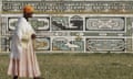 An elderly woman in long patterned dress and white shawl walks with the aid of a stick after casting her vote in Mpumalanga, South Africa