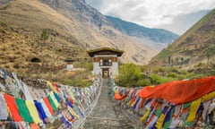 Iron Chain Bridge with colourful prayer flags.