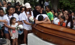 Mourners with coffin