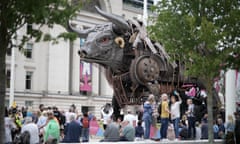 Members of the public take pictures of the bull in the city centre during day One of the Birmingham 2022 Commonwealth Games on July 29, 2022.