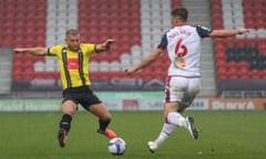 George Thomson of Harrogate Town goes in for a tackle on Ryan Delaney of Bolton Wanderers in Harrogate Town v Bolton Wanderers at CNG Stadium, Harrogate on 3 October 2020