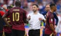 Domenico Tedesco shakes hands with striker Romelu Lukaku