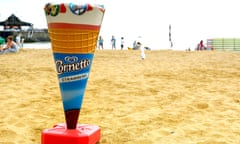 A sign for ice-cream on a beach