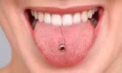 Female mouth with tongue piercing