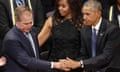 Barack Obama, Michelle Obama, George W. Bush<br>President Barack Obama, left, and first lady Michelle Obama, center, reach out to former President George W. Bush, left during a memorial service at the Morton H. Meyerson Symphony Center with the families of the fallen police officers, Tuesday, July 12, 2016, in Dallas. Five police officers were killed and several injured during a shooting in downtown Dallas last Thursday night. (AP Photo/Eric Gay)