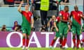 Cristiano Ronaldo celebrates scoring from the penalty spot during Portugal's 3-2 win over Ghana in the World Cup match at Stadium 974 in Doha.