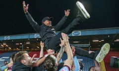 The Burnley manager, Vincent Kompany, is lifted up by his players after victory at Blackburn