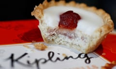 a cherry bakewell tart atop a Mr Kipling box