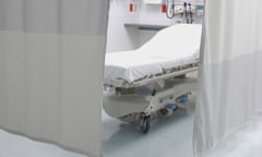 Privacy curtains around a hospital bed