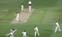 Alex Carey (bottom) of Australia takes a catch to dismiss Chris Woakes.