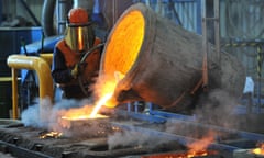 A factory worker pours molten iron at Backwell IXL in Geelong.