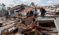 US-WEATHER-HURRICANE<br>A couple react as they go through their destroyed mobile home following the passing of hurricane Laura in Lake Charles, Louisiana, on August 27, 2020. - Hurricane Laura tore off roofs and shredded buildings in the southern US state of Louisiana as it slammed into the coast early on August 27 killing at least one person, with shaken residents emerging to survey the damage. Forecasters warned of the continued risk of a storm surge as the hurricane -- one of the strongest to ever hit the region -- moved inland and weakened rapidly. (Photo by ANDREW CABALLERO-REYNOLDS / AFP) (Photo by ANDREW CABALLERO-REYNOLDS/AFP via Getty Images)