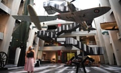 A gallery assistant poses with Chinese artist Ai Weiwei’s new artwork, History of Bombs, at the Imperial War Museum in London.