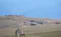 The view across open countryside from the Armenian village of Tegh of an Azerbaijani border guard post