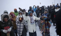 Beatrice Menase Kwe Jackson<br>In this Tuesday, Nov. 29, 2016 photo, Beatrice Menase Kwe Jackson of the Ojibwe Native American tribe leads a song during a traditional water ceremony along the Cannonball river at the Oceti Sakowin camp where people have gathered to protest the Dakota Access oil pipeline in Cannon Ball, N.D. The pipeline is largely complete except for a short segment that is planned to pass beneath a Missouri River reservoir. The company doing the building says it is unwilling to reroute the project. (AP Photo/David Goldman)