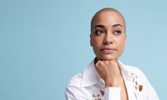 Head shot of actor Cush Jumbo in white shirt against blue background