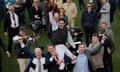 Flooring Porter’s connections lift jockey Danny Mullins in the air after their Stayers’ Hurdle win.