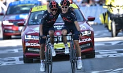 Michal Kwiatowski (right) and his Ineos Grenadiers teammate Richard Carapaz celebrate after coming home first and second in La Roche-sur-Foron